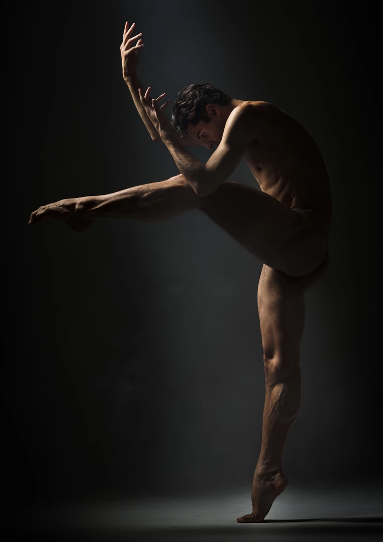 male dancer posing en pointe, professional dance photography 