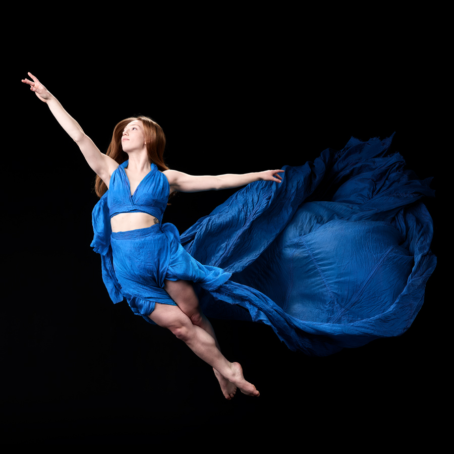 female dancer posing with flowing outfit, creative dance photography 