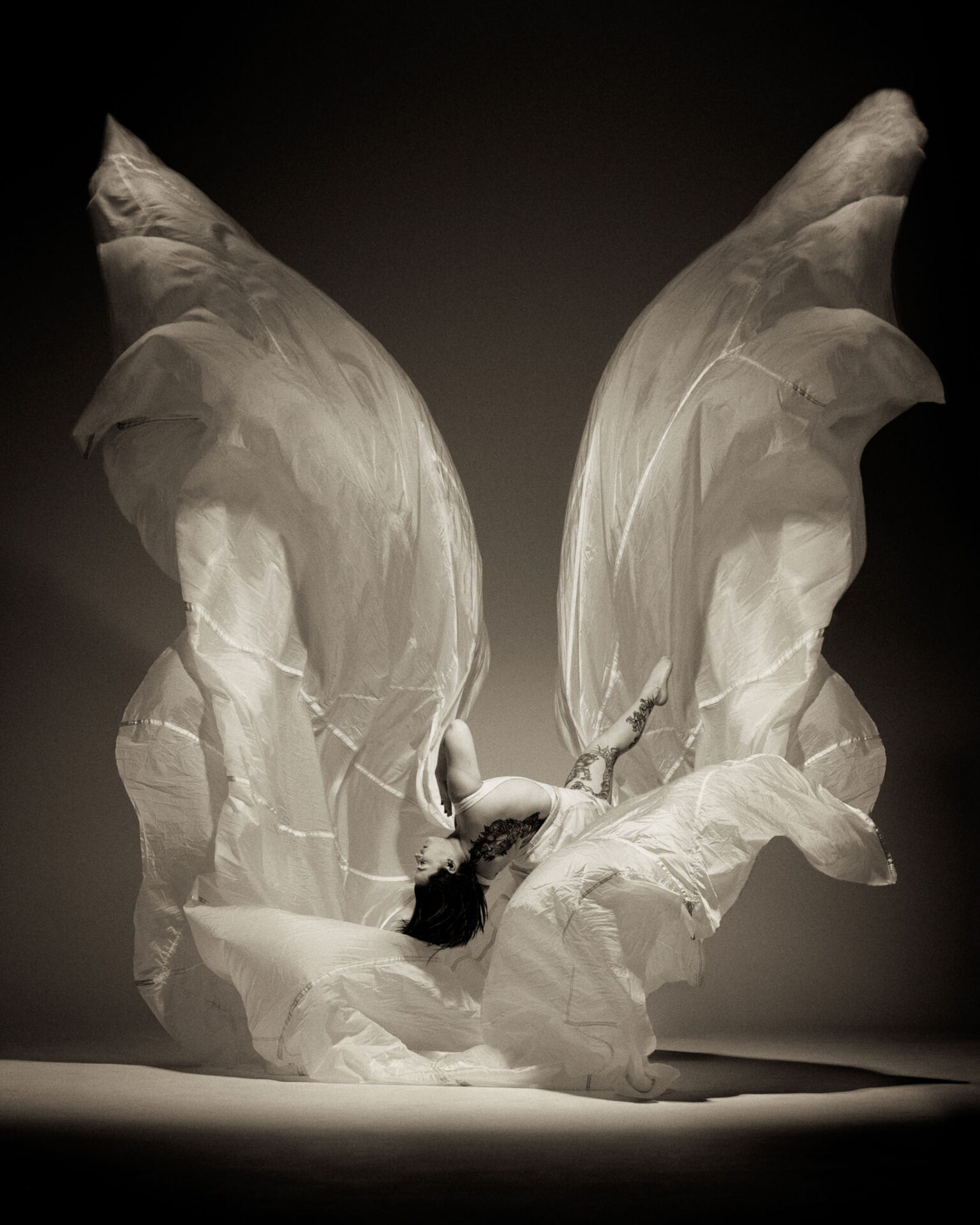 creative dance photography, female dancer in fabric 